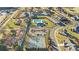 Aerial view showing community pool, tennis courts, and surrounding homes at 136 Margo Ln, Statesville, NC 28677