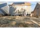 Spacious backyard with patio, fire pit, and solar panels at 136 Margo Ln, Statesville, NC 28677