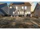 Landscaped backyard with patio, fire pit, and solar panels at 136 Margo Ln, Statesville, NC 28677