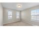 Well-lit bedroom featuring three windows at 136 Margo Ln, Statesville, NC 28677