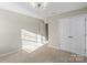 Bedroom with double doors and window coverings at 136 Margo Ln, Statesville, NC 28677