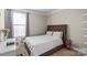 Cozy bedroom with a queen-size bed and built-in shelving at 136 Margo Ln, Statesville, NC 28677