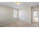 Bright bedroom with double doors and carpet at 136 Margo Ln, Statesville, NC 28677