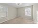 Bedroom with two windows and carpet flooring at 136 Margo Ln, Statesville, NC 28677