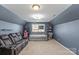 Finished bonus room with seating area and home office space at 136 Margo Ln, Statesville, NC 28677