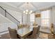 Formal dining room with hardwood floors, chandelier, and coffered ceiling at 136 Margo Ln, Statesville, NC 28677