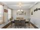 Formal dining room with a chandelier, hardwood floors, and wainscoting at 136 Margo Ln, Statesville, NC 28677