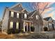 Beautiful two-story home with brick exterior and landscaping at dusk at 136 Margo Ln, Statesville, NC 28677