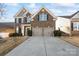 Two-story home with a three-car garage and attractive landscaping at 136 Margo Ln, Statesville, NC 28677