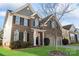 Charming two-story brick home with well-maintained lawn and landscaping at 136 Margo Ln, Statesville, NC 28677