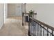 Upstairs hallway with laundry room access and railing at 136 Margo Ln, Statesville, NC 28677