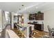 Modern kitchen with granite island, dark cabinetry, and stainless steel appliances at 136 Margo Ln, Statesville, NC 28677