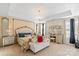 Elegant main bedroom with a large bed and chandelier at 136 Margo Ln, Statesville, NC 28677