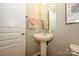 Small bathroom with pedestal sink and updated fixtures at 14021 Labeau Ave, Charlotte, NC 28277