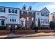 Brick front townhouse with well-maintained landscaping at 14021 Labeau Ave, Charlotte, NC 28277