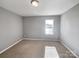 Bright bedroom featuring neutral walls and carpet flooring at 1520 Waylon Ave, Gastonia, NC 28054