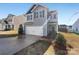 Two-story house with gray siding and a two-car garage at 1520 Waylon Ave, Gastonia, NC 28054