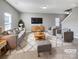 Virtually staged living room with gray sofas and a coffee table at 1520 Waylon Ave, Gastonia, NC 28054