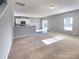 Open living room, carpeted floor, kitchen view at 1520 Waylon Ave, Gastonia, NC 28054