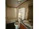 A bathroom with a tub, toilet, and vanity at 181 Jeter St, Chester, SC 29706