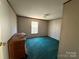 A bedroom with green carpet and dresser at 181 Jeter St, Chester, SC 29706