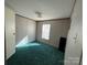 A bedroom with green carpet and a window at 181 Jeter St, Chester, SC 29706