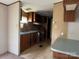 Galley kitchen with wood cabinets and laminate counters at 181 Jeter St, Chester, SC 29706