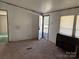 Empty living room with carpet and open doorway at 181 Jeter St, Chester, SC 29706