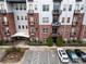 Aerial view of a modern apartment building with ample parking at 2338 Yadkin Ave # 203, Charlotte, NC 28205