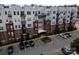 An apartment building with parking and surrounding landscape at 2338 Yadkin Ave # 203, Charlotte, NC 28205