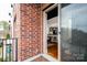 Private balcony with access to kitchen and brick exterior at 2338 Yadkin Ave # 203, Charlotte, NC 28205