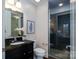 Modern bathroom with granite vanity, walk-in shower, and toilet at 2338 Yadkin Ave # 203, Charlotte, NC 28205