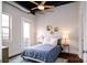 Bright bedroom with a queen bed, balcony access, and stylish decor at 2338 Yadkin Ave # 203, Charlotte, NC 28205