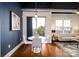 Bright dining area with a round table and chairs, near a living room and balcony at 2338 Yadkin Ave # 203, Charlotte, NC 28205