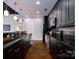 Sleek kitchen with dark cabinets, granite countertops, stainless steel appliances, and an island at 2338 Yadkin Ave # 203, Charlotte, NC 28205