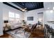 Open living area with a sofa, armchairs, coffee table, and a large window at 2338 Yadkin Ave # 203, Charlotte, NC 28205