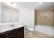 Bathroom with a single sink vanity, toilet, and a tub with tiled walls at 24078 Sailfish Dr # 1152, Lancaster, SC 29720