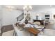 Dining room features stylish chandelier and offers a view of the kitchen and staircase at 24078 Sailfish Dr # 1152, Lancaster, SC 29720