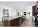 Open-concept kitchen features a large island with stainless steel dishwasher and sink at 24078 Sailfish Dr # 1152, Lancaster, SC 29720