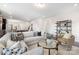 Spacious living room features a cozy sofa, stylish decor, and an open layout connecting to the dining area at 24078 Sailfish Dr # 1152, Lancaster, SC 29720