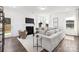 Bright living room featuring a fireplace, a cozy chair, and ample natural light through large windows at 24078 Sailfish Dr # 1152, Lancaster, SC 29720