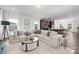 A modern living room flows into the kitchen area, creating an open and inviting living space at 24078 Sailfish Dr # 1152, Lancaster, SC 29720