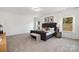 Relaxing main bedroom offers serene ambiance with soft carpet, large windows, and neutral color palette at 24078 Sailfish Dr # 1152, Lancaster, SC 29720