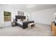 Relaxing main bedroom offers serene ambiance with soft carpet, large windows, and neutral color palette at 24078 Sailfish Dr # 1152, Lancaster, SC 29720