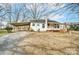 White house exterior with carport and small deck at 3113 Concord Hwy, Monroe, NC 28110