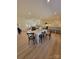 Open concept dining room with hardwood floors and a white table at 315 Toney St, Shelby, NC 28152