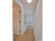 Long hallway with light walls and wood-look flooring, offering access to other rooms at 315 Toney St, Shelby, NC 28152