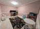 Finished basement room, ideal as an office or playroom, featuring built-in workspace and ample floor space at 327 Johnson Dairy Rd, Mooresville, NC 28115