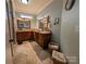 Double vanity bathroom with granite countertops and wood cabinets at 327 Johnson Dairy Rd, Mooresville, NC 28115