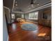 Main bedroom with hardwood floors and large windows at 327 Johnson Dairy Rd, Mooresville, NC 28115